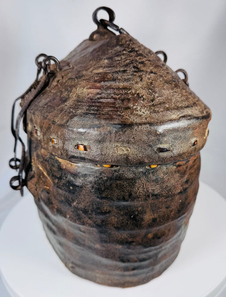 Rare woven reed and hide travel basket displaying traditional indigenous craftsmanship