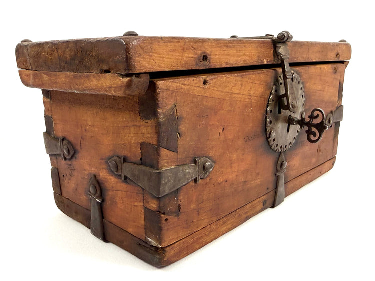 Antique Himalayan Merchant Strongbox with hand-forged iron corner straps and ornate scroll-key in lock