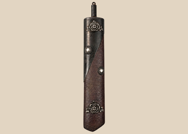 Antique Japanese Meiji period gunpowder flask with floral mixed-metal decoration, securing chain and original collector tag
