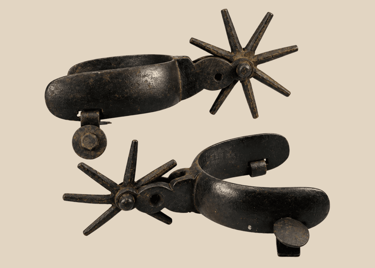 Antique Mexican Charro cowboy spurs with large star rowels and rich patina