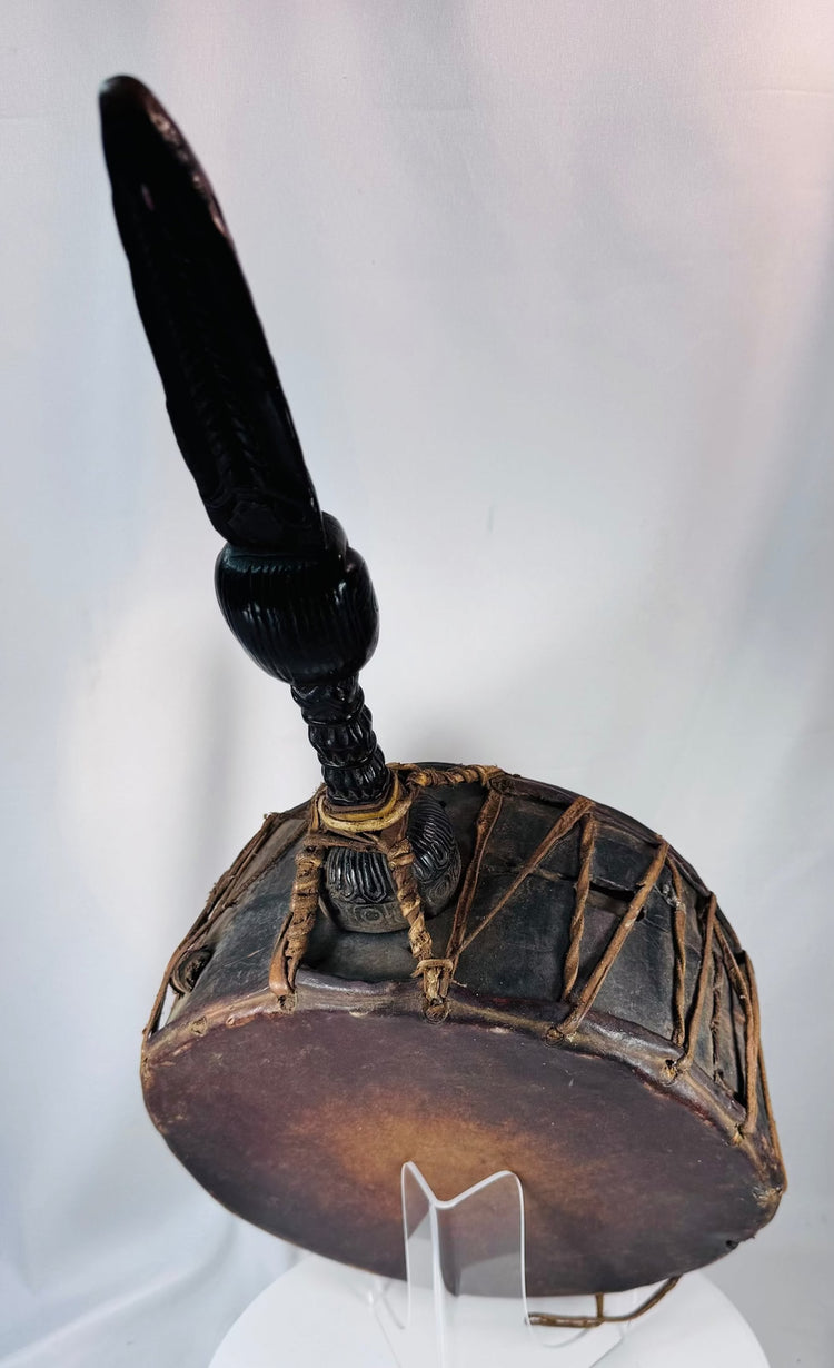 Handcrafted Nepal shaman's drum with original striker, carved handle, and evidence of prolonged ceremonial use.