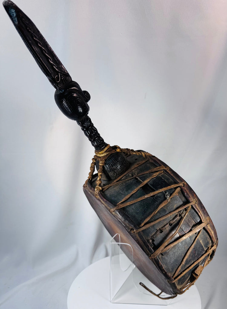 Ethnographic Himalayan Dhyāngro drum featuring aged hardwood, leather cordage, and ritual carving.