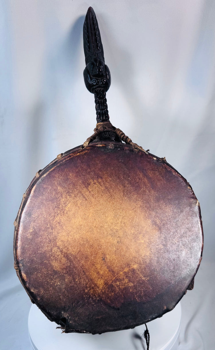 Antique Nepal shamanic drum with anthropomorphic carved handle and original curved wooden beater.