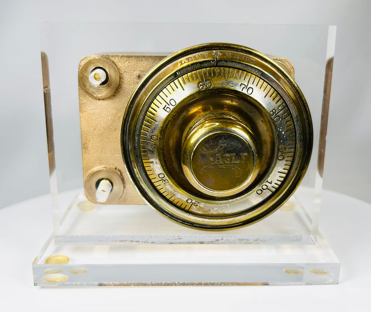 Antique combination dial lock mechanism with cast metal body and patina