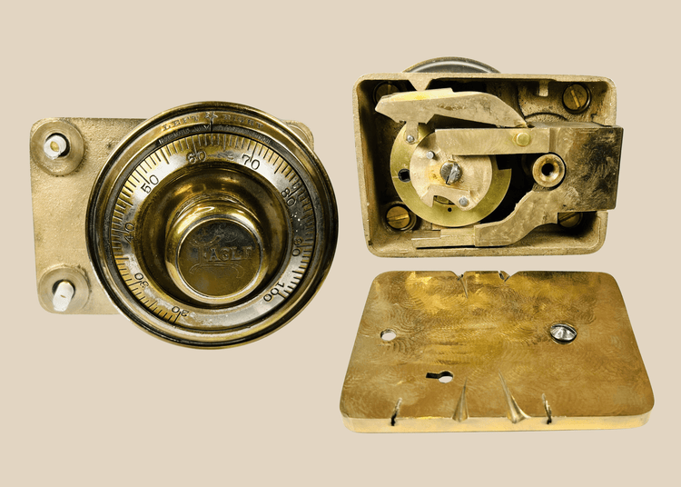 Antique Eagle safe lock mechanism with brass combination dial front view