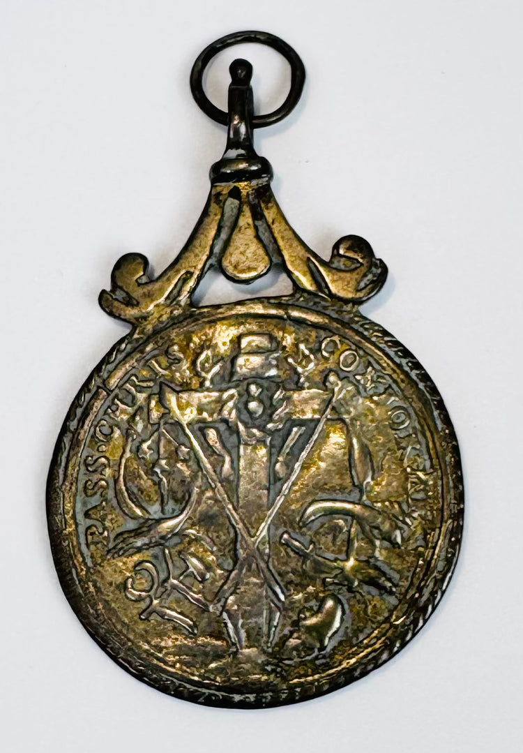 European religious artifact depicting Saint Anthony of Padua, crafted as a wearable devotional medal.