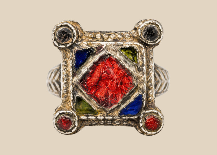 19th–early 20th century North African or Middle Eastern hand-forged silver ring with bold rectangular bezel, geometric incised motifs, thick shank, and rich patina, traditional tribal or Ottoman-influenced jewelry