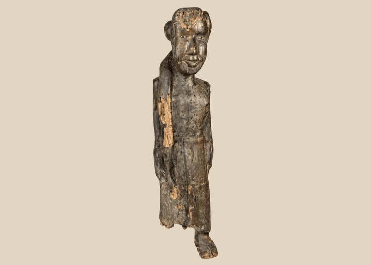 Antique Dayak ancestral wooden figure from Borneo with encrusted patina