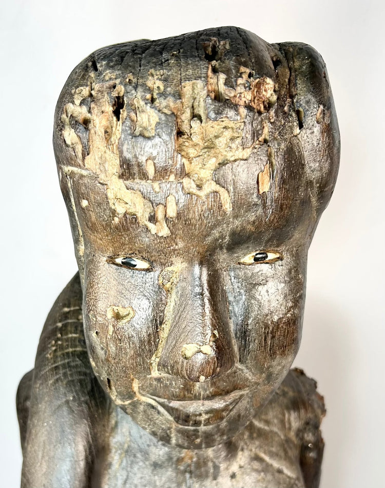 Indonesian Dayak wooden sculpture with inset eyes and ritual wear
