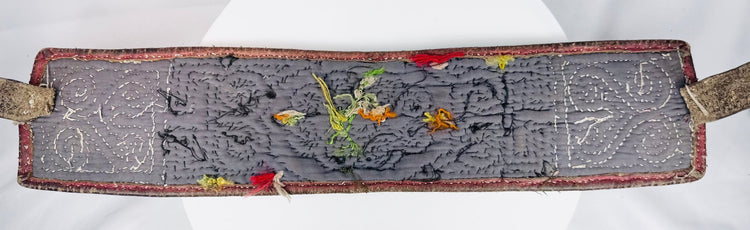 Back view of Tibetan warrior belt showing hand stitching, straps, wear, and old repairs
