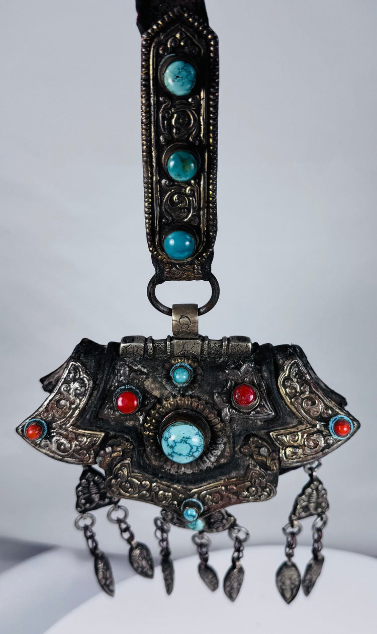 Large Tibetan gau shrine pendant with suspended leaf-shaped drops and decorative turquoise stone settings.