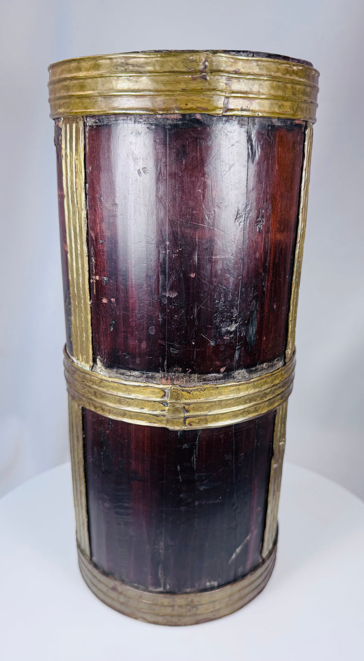 Antique Tibetan food storage container constructed from hardwood and reinforced with brass strips.