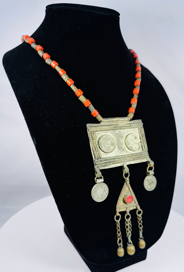 Antique Central Asian Turkmen pectoral necklace with suspended medallions, triangular amulet, and handcrafted decorative chains.