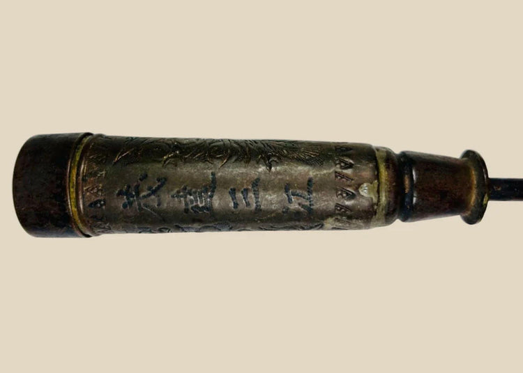 Antique Chinese temple candle holder from the Late Qing Dynasty (circa 1850–1911), cylindrical bronze form with engraved Chinese inscriptions and decorative motifs, mounted on a tapered base; patinated surface with signs of ritual use, once employed in Buddhist or Daoist temple settings as part of ceremonial altar furnishings.