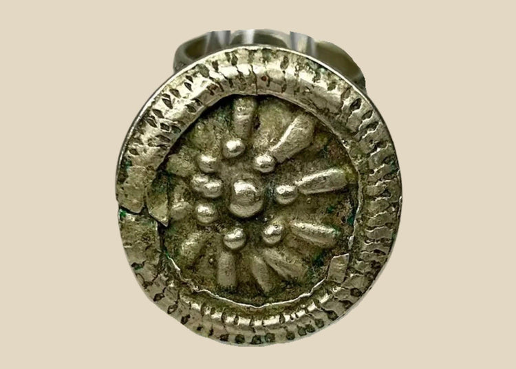 Late 19th century European silver-toned ring with raised rosette floral motif, beaded border, and tapered band, antique Victorian-era jewelry piece