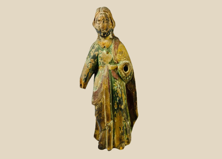 17th–18th century Spanish Colonial wooden statue of a saint or religious figure, hand-carved with flowing drapery and expressive face. Remnants of polychrome paint, surface wear, and a missing arm reflect centuries of devotional use in churches, chapels, or private altars, showcasing Colonial religious artistry.