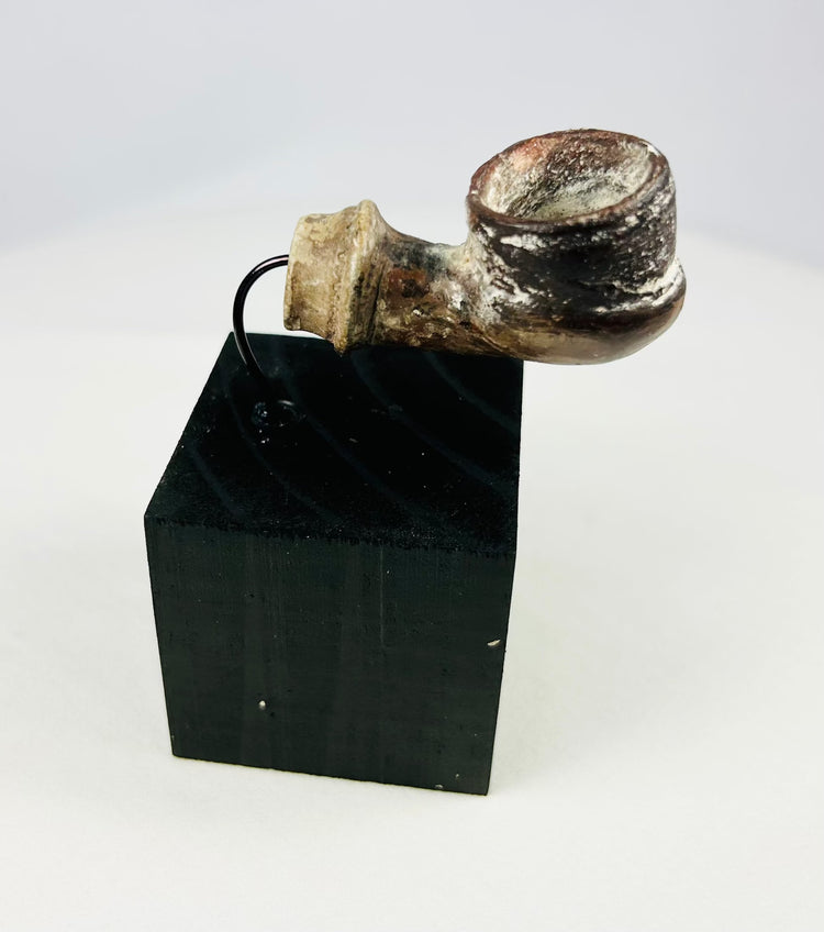 Archaeological ceramic fragment from the Middle East with mineral accretions and weathered surface