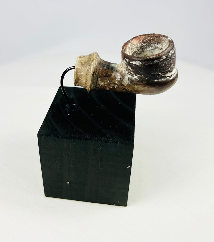 Archaeological ceramic fragment from the Middle East with mineral accretions and weathered surface
