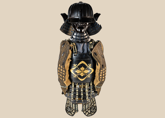 Authentic Japanese samurai armor set from the Muromachi Period (1333–1573), featuring a black-lacquered 24-plate suji-bachi kabuto helmet, menpo facial armor, gold-painted mon on the cuirass, Edo-period silk lacing, and chainmail sleeves, displayed on a wooden stand.