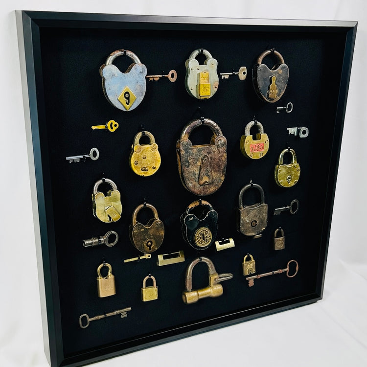 Vintage locks and keys wall display with skeleton keys and heavy iron locks