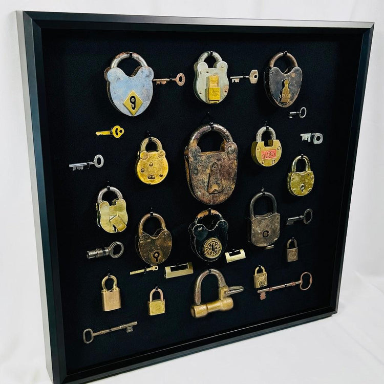 Vintage locks and keys wall display with skeleton keys and heavy iron locks
