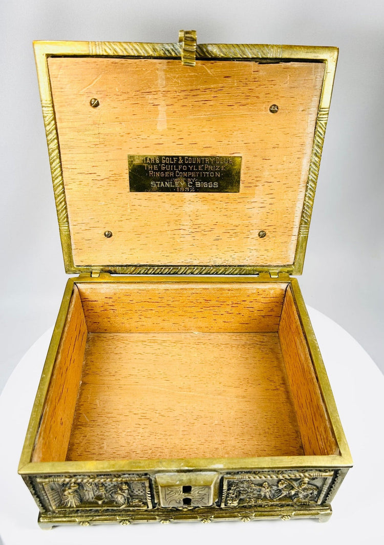Decorative bronze box with courtly scenes and ornate Renaissance motifs