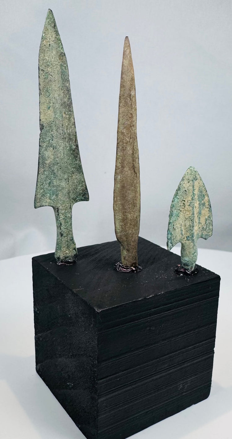 Long narrow lanceolate bronze arrowhead with brown mineral patination