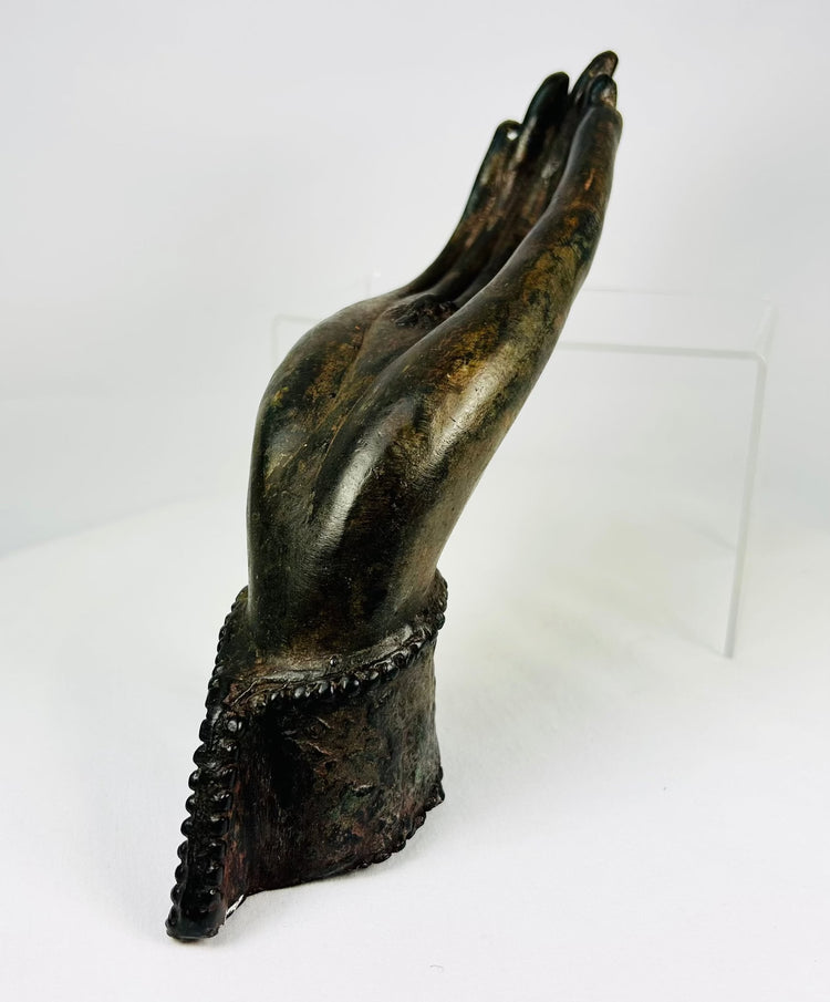 Lao bronze Buddha hand in gesture of reassurance, aged patina with malachite highlights.