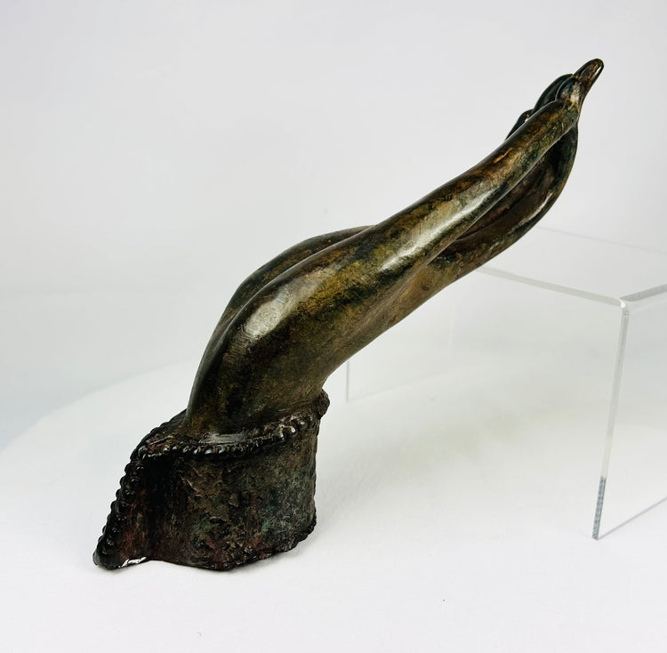 Ayutthaya period bronze Buddha hand fragment with beaded wrist cuff and rosette emblem.