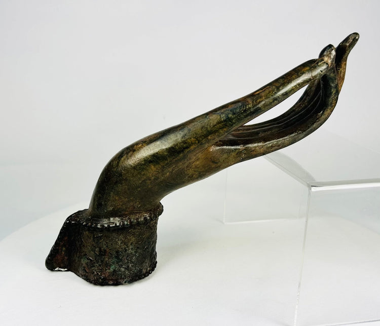 Southeast Asian Buddhist bronze hand, Vitarka mudra form, deep olive patina and earthen accretions.