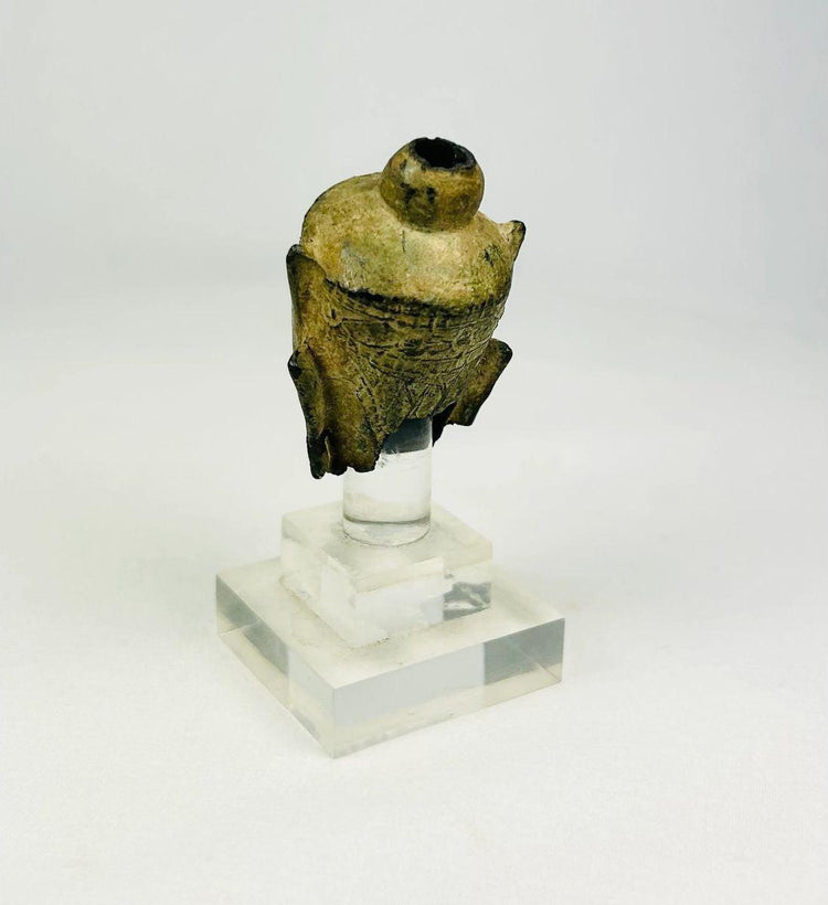 Angled view of a cast bronze Buddha head from Southeast Asia