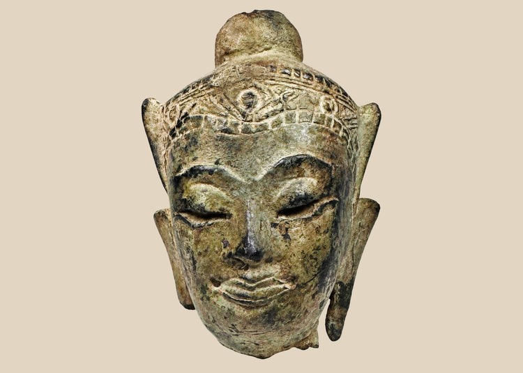 Antique cast bronze Buddha head with arched brows and subtle smile, Southeast Asia 15th-18th Century