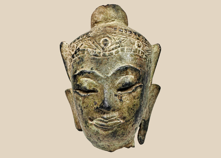 Fragmentary cast bronze Buddha head with serene expression, arched brows, closed eyes, subtle smile, and engraved crown band; traces of gilt and lacquer; likely Thailand or Burma, Late Ayutthaya–Early Rattanakosin or Toungoo–Konbaung period, circa 15th–18th century CE; mounted on a custom acrylic stand.