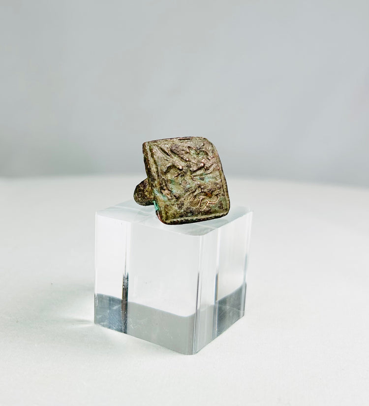 Ancient cast bronze ring with square bezel engraved with twin birds symbolizing harmony and companionship, natural green patina, 1st–5th century CE, Mediterranean or Middle Eastern origin, US size 1.