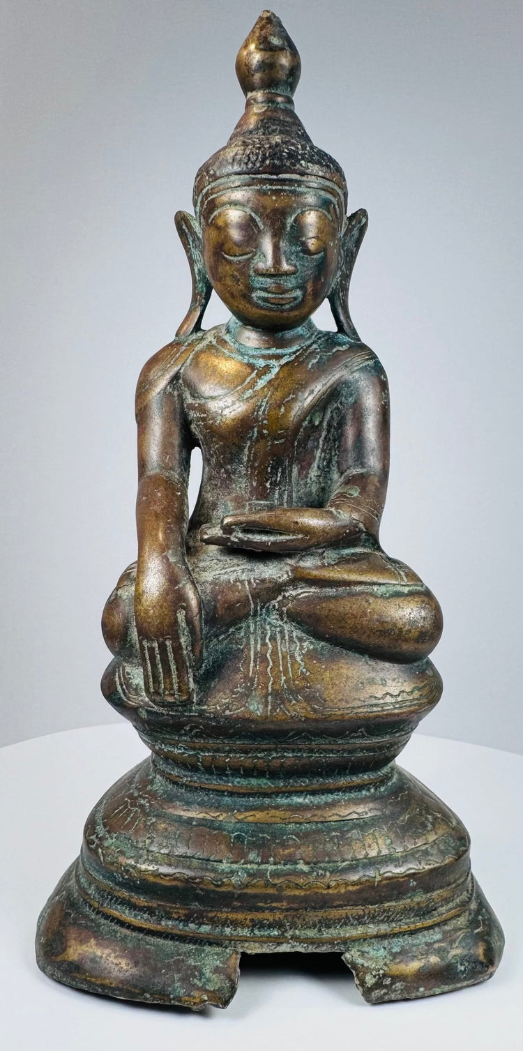 Burmese Shakyamuni Buddha seated upon a lotus throne and tiered pedestal