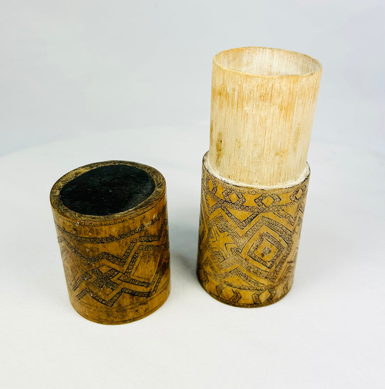 Island Southeast Asian bamboo lime container with geometric pigment-darkened carvings