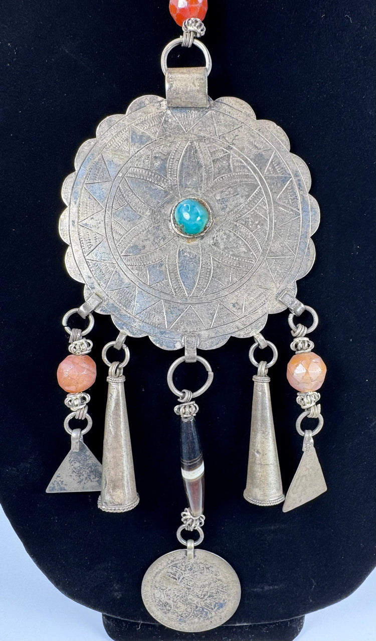 Afghan or Pashtun necklace with conical drops, triangular pendants, and worn coin