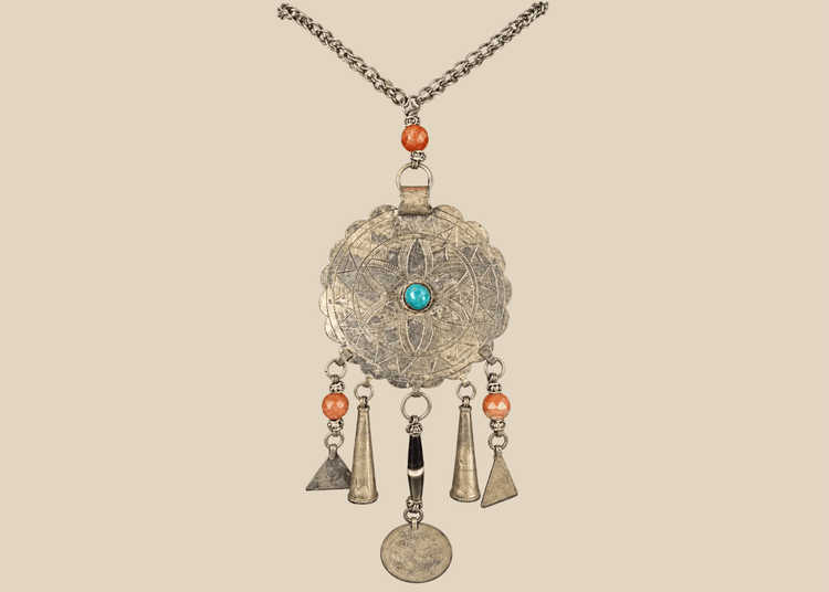 Tribal Afghan necklace with engraved circular pendant, turquoise-coloured cabochon, beads, and coin drop