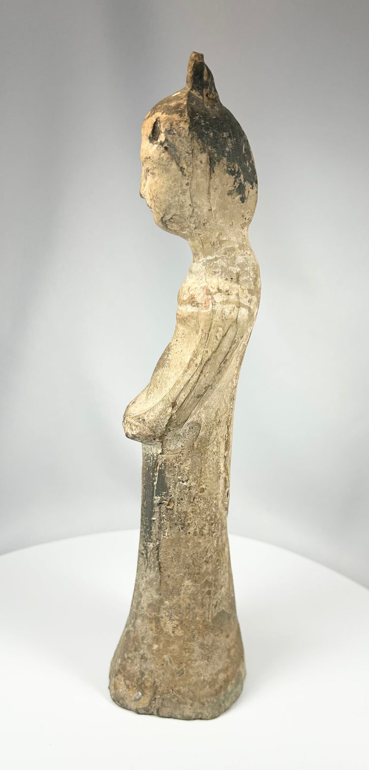 Antique Chinese pottery figure showing kiln imperfections and surface aging