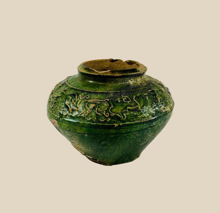 Han Dynasty green-glazed pottery vessel with molded relief figures of humans and animals, funerary mingqi, ancient China, circa 202 BCE–220 CE.