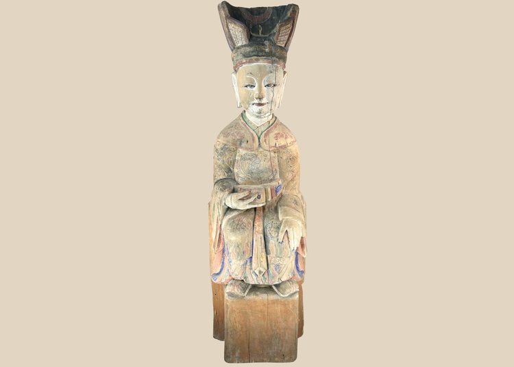 Chinese carved wooden sculpture of a seated court official with original polychrome decoration.