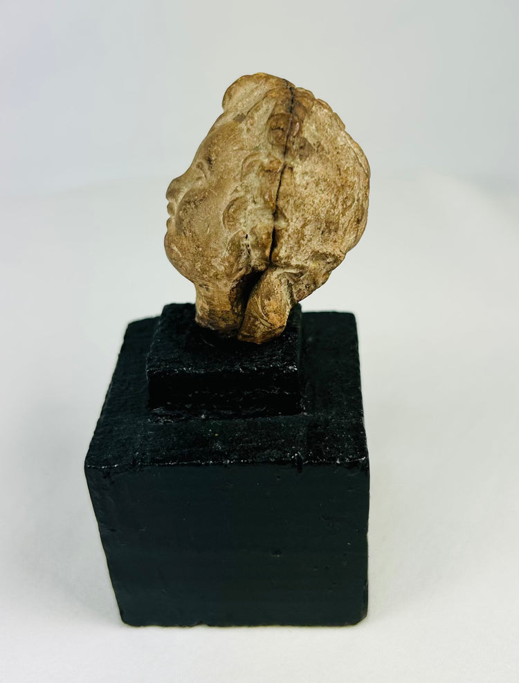 Antique terracotta head fragment, classical period, patinated surface, 1st millennium BCE–CE