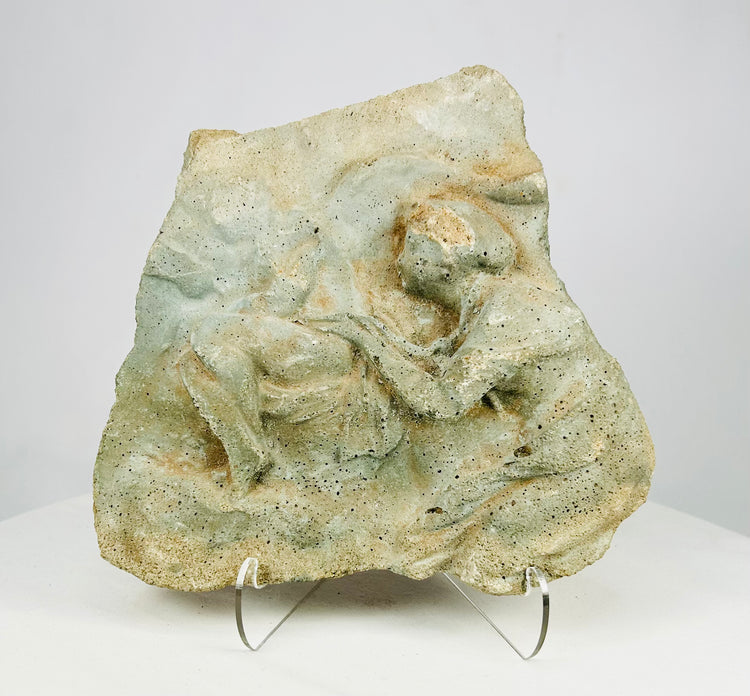 Front view of a Classical carved limestone relief fragment depicting two human figures, Mediterranean or Near Eastern, circa 500 BCE–500 CE.