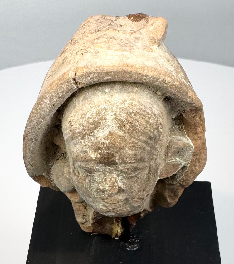Ancient classical terracotta head fragment, circa 1st millennium BCE to 1st millennium CE, with serene expression and preserved sculptural details.
