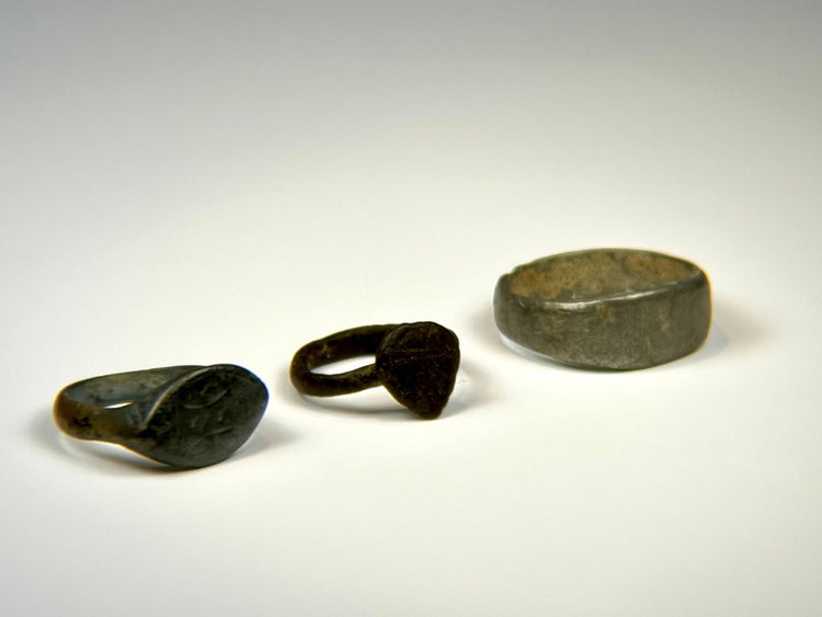Historic bronze oval bezel ring with tapered band and centuries-old green-brown patina