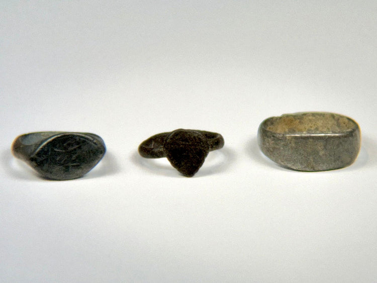 Group of three ancient bronze finger rings spanning the Roman to Medieval periods
