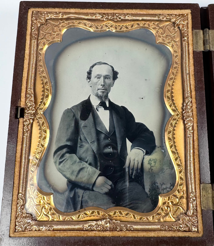 Two original glass ambrotypes housed in a molded floral union case
