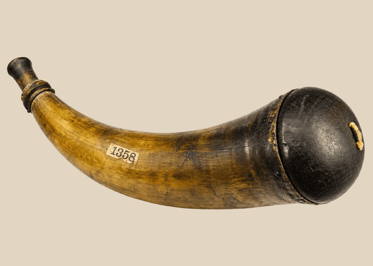 Historic 18th–early 19th century powder horn made from natural animal horn with wooden stopper and fitted base.