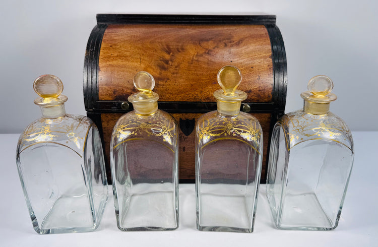 Early 19th century Georgian mahogany spirit box with four parcel-gilded glass decanters and red fitted interior