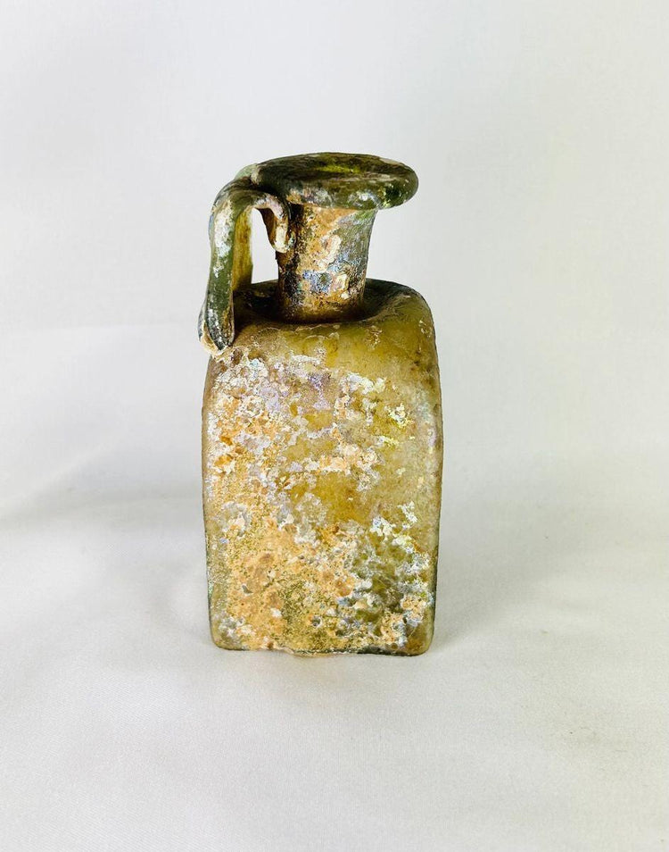 Early Imperial Roman square glass bottle four-leaf maker’s mark 1st century CE